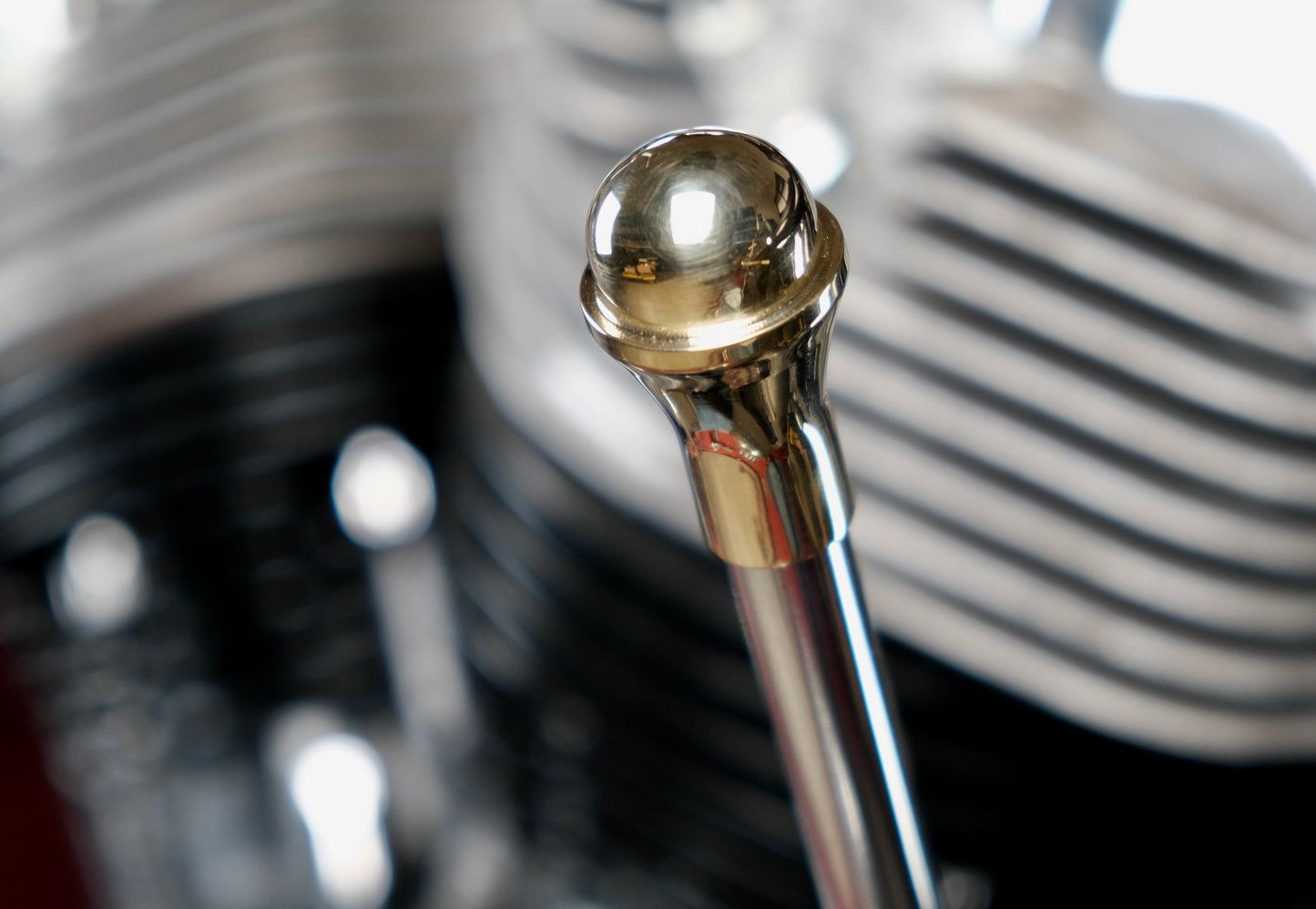 Edward Richie brass jokey shift knob mounted on a shifter on a shovel head motorcycle