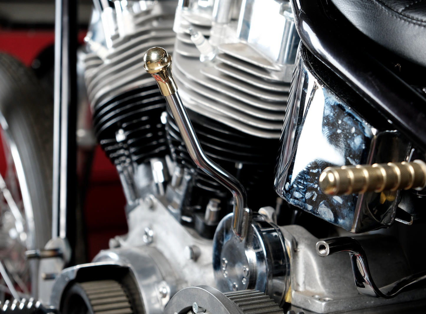 stainless ratchet top jockey shifter with brass handle mounted one a shovel head rear view